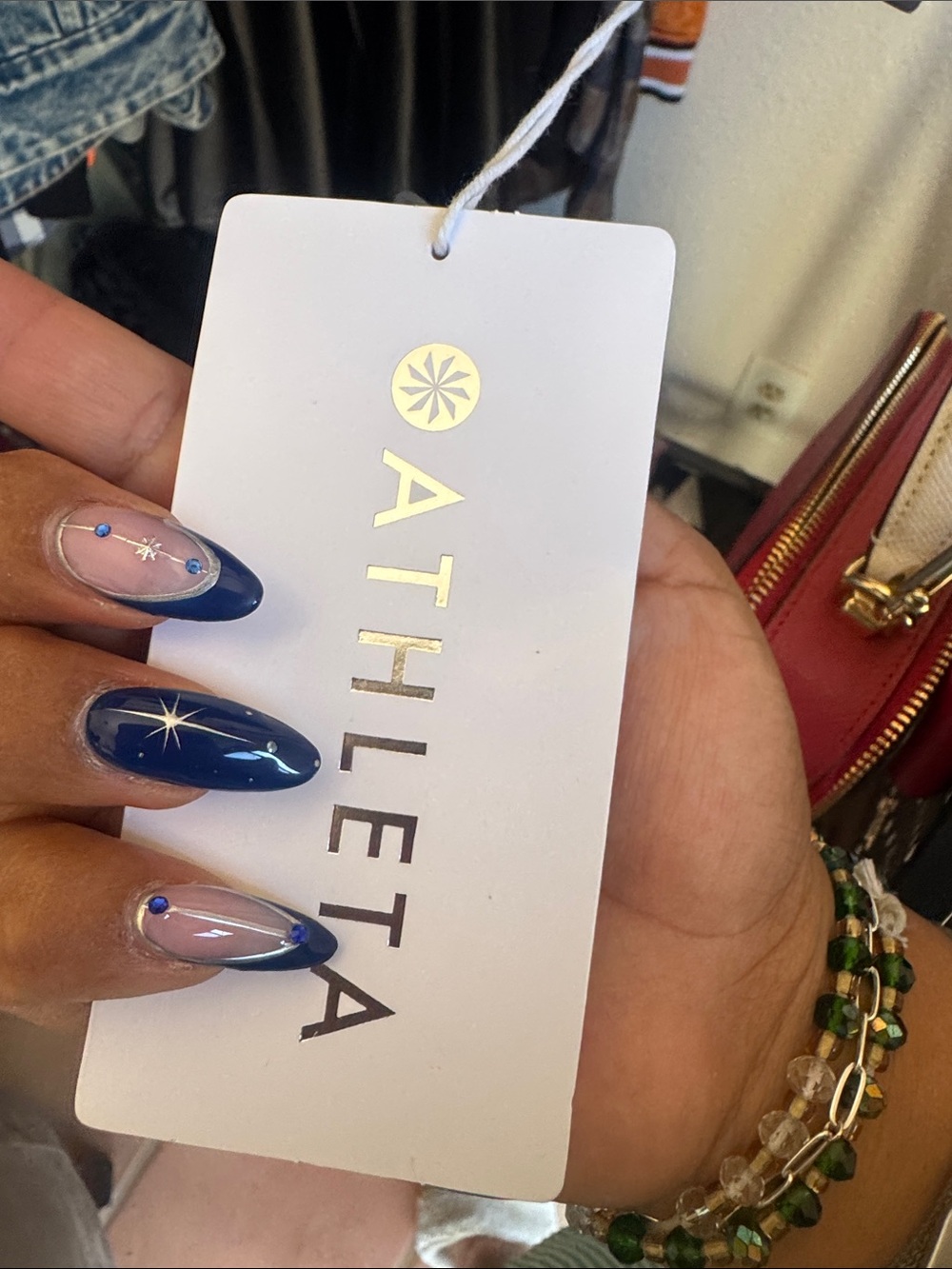Athleta White and Gold Branded Hang Tag